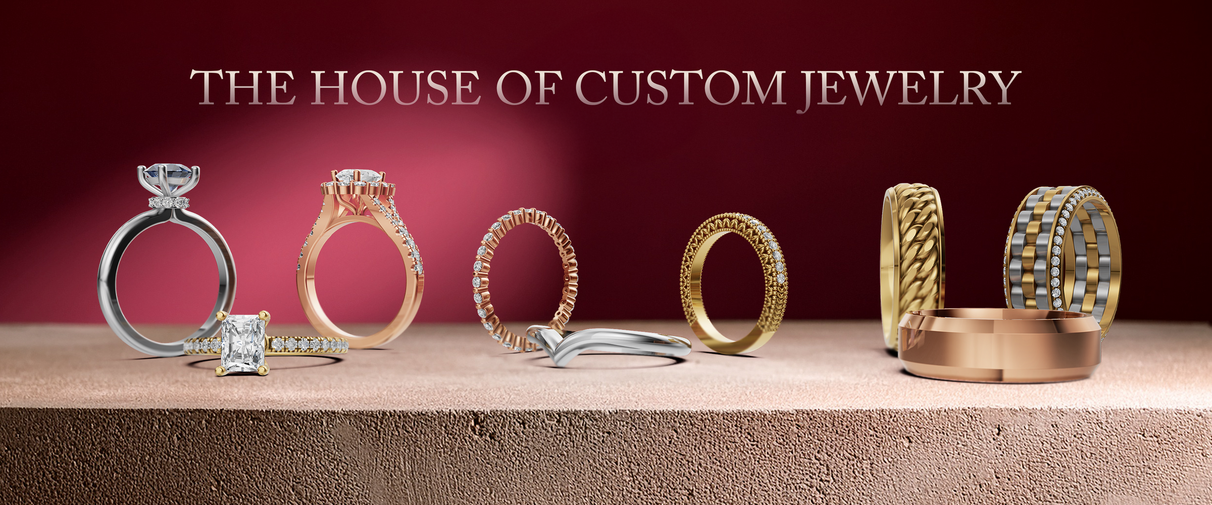 Collection of gold rings on a wooden surface with 'The House of Custom Jewelry' branding.