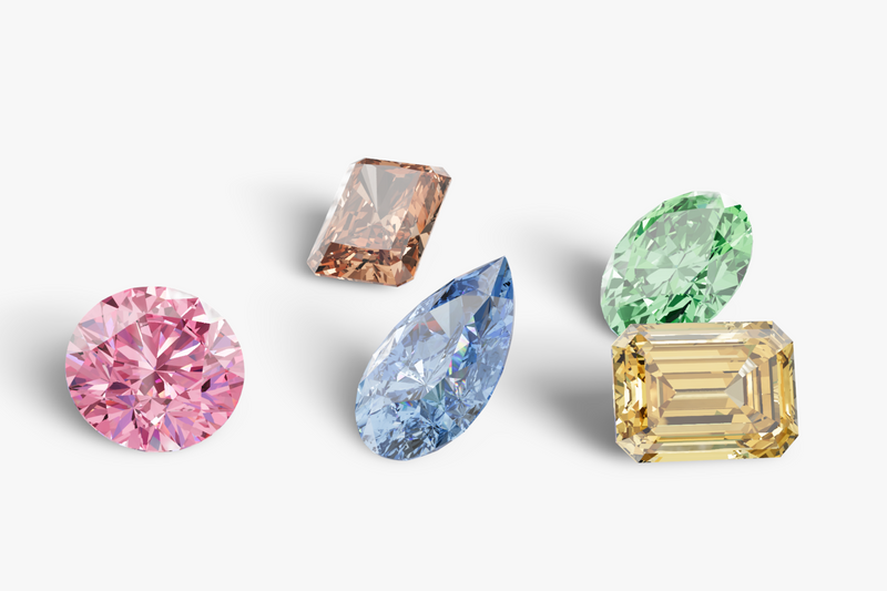 Five colorful diamonds of different shapes and colors on a light gray background