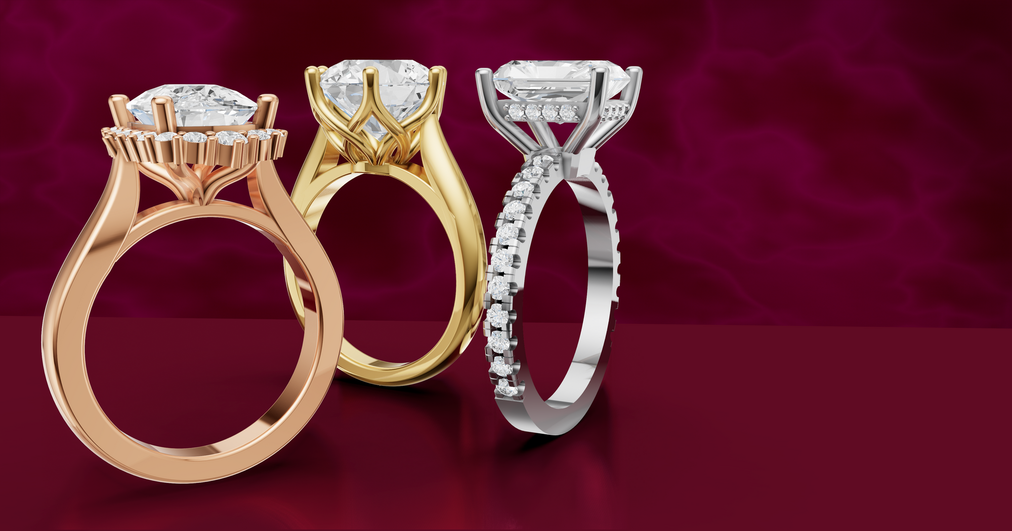 gold, rose gold and white gold diamond rings on a red background
