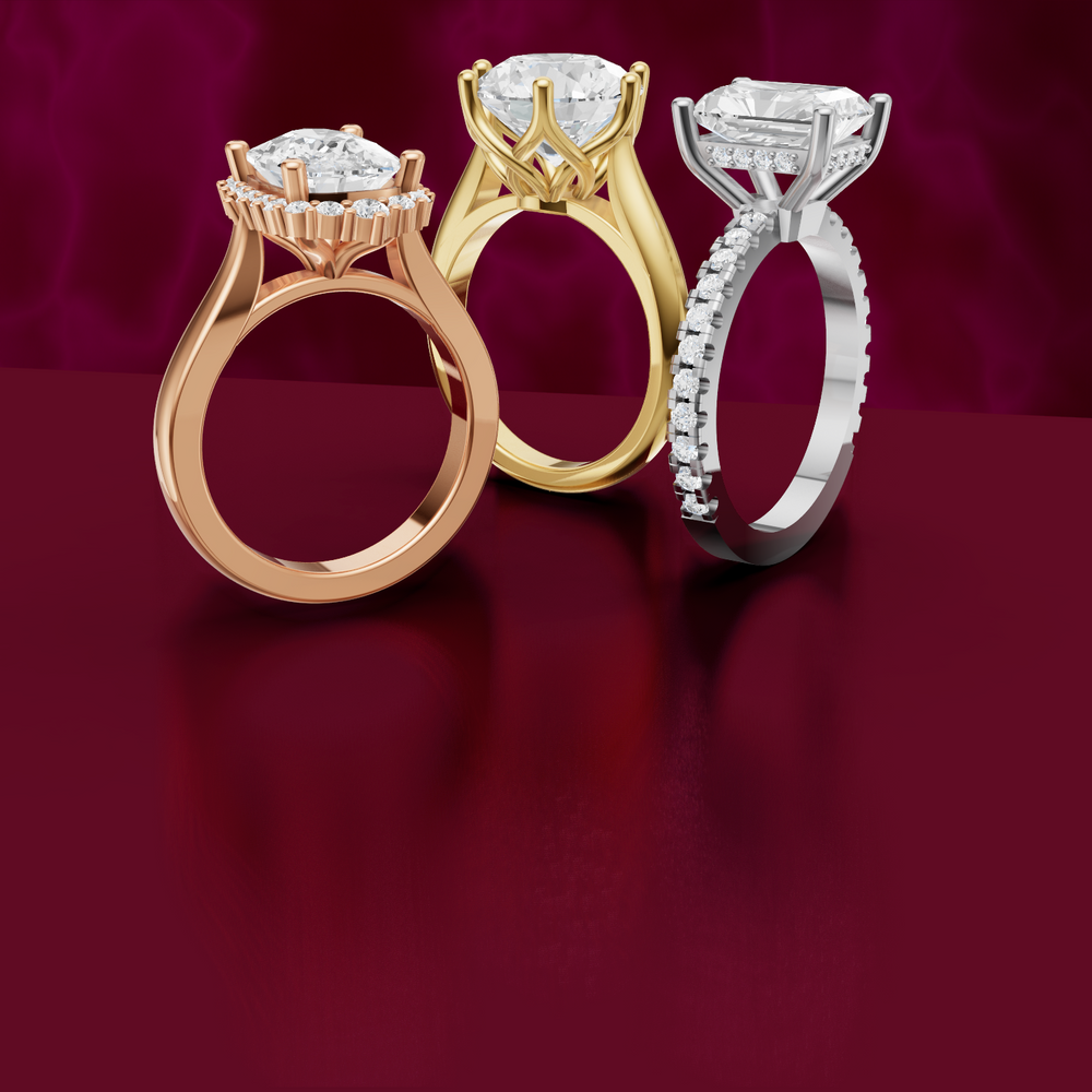 gold, rose gold and white gold diamond rings on a red background