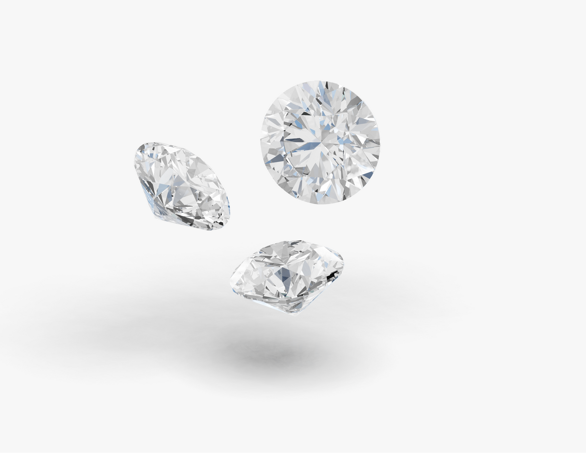 Three round diamonds on a light gray background