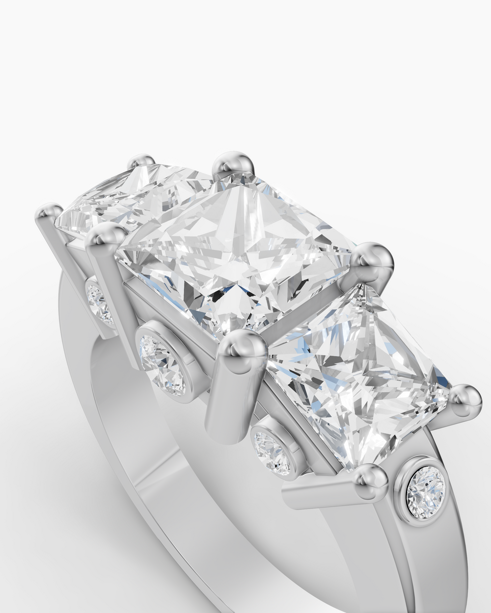 Diamond ring with a rectangular center stone on a white background