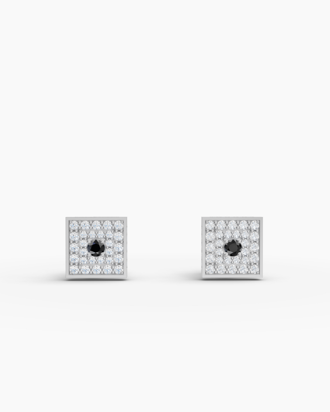 Pair of square-shaped earrings with black gemstones on a white background