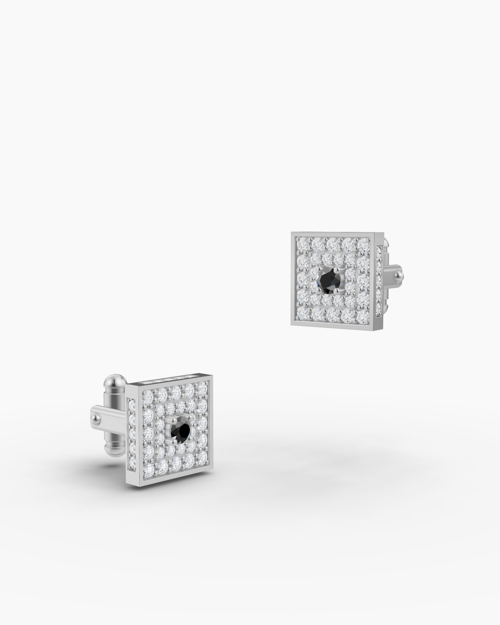 Pair of square cufflinks with black center stones on a white background