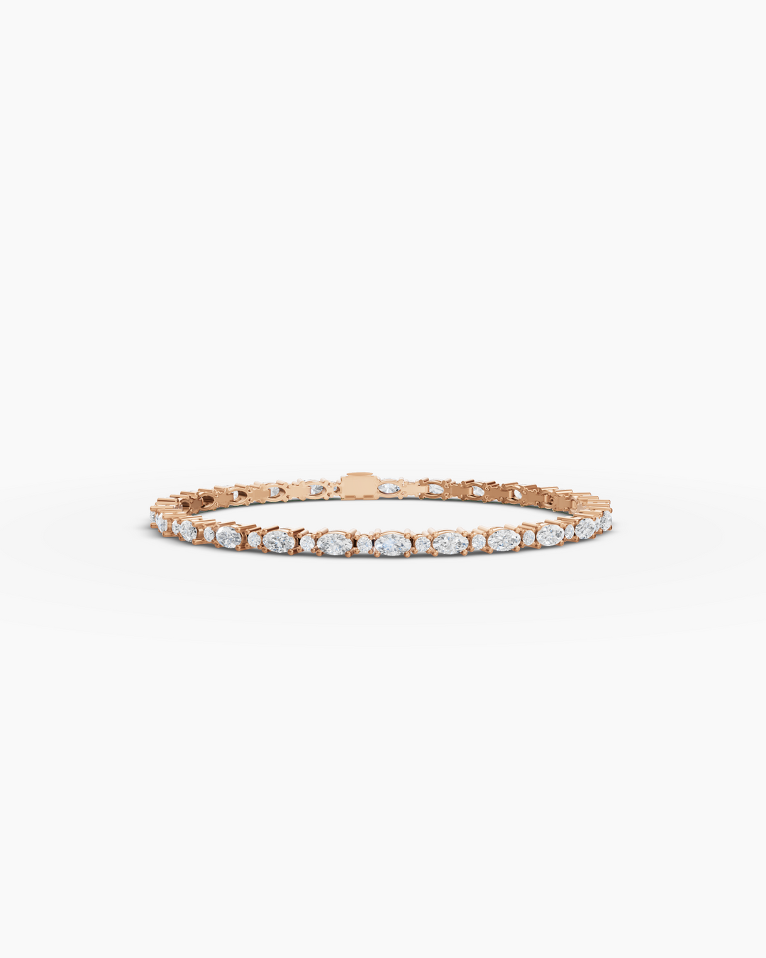 Rose gold bracelet with clear stones on a white background