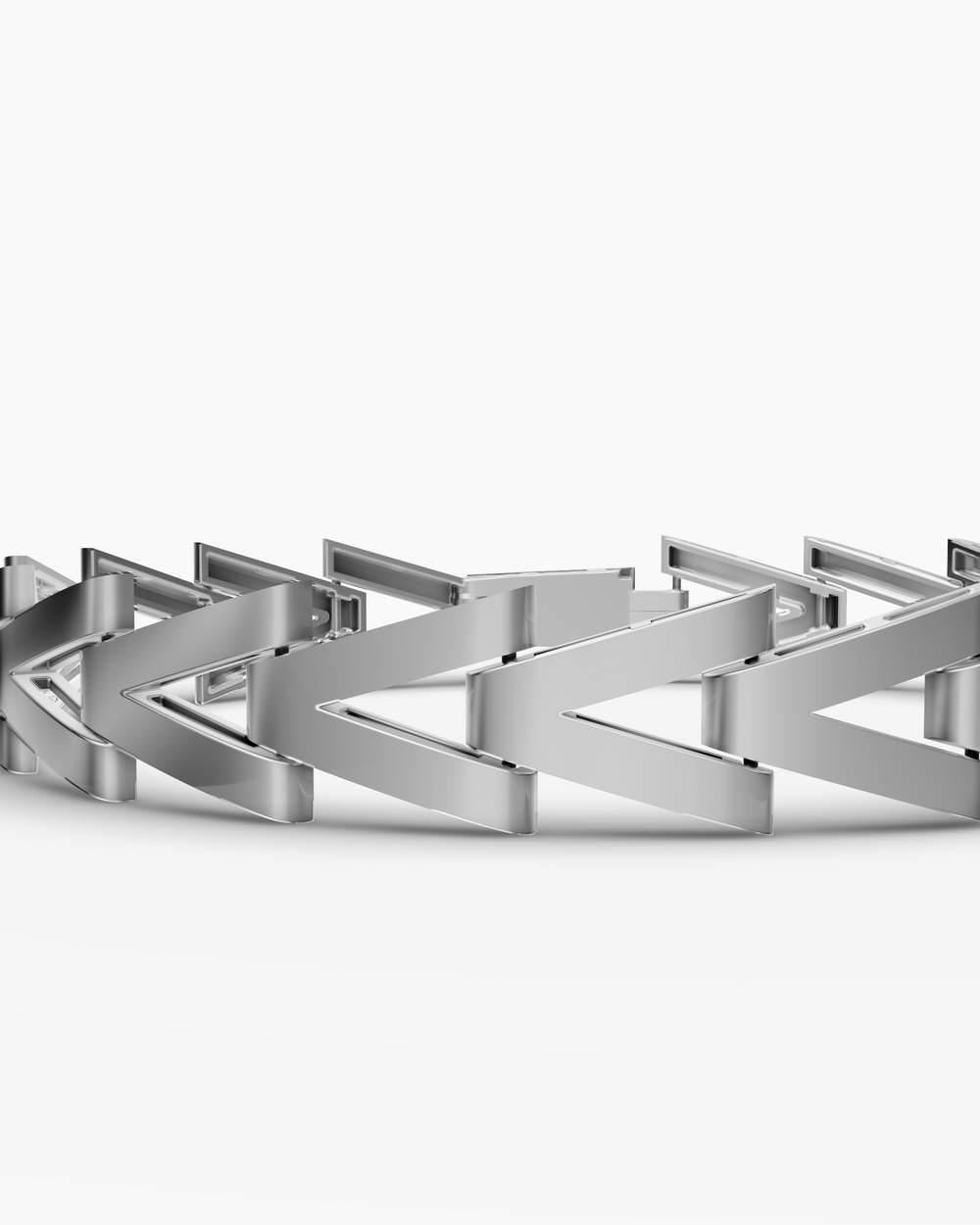 Silver bracelet with a geometric design on a white background