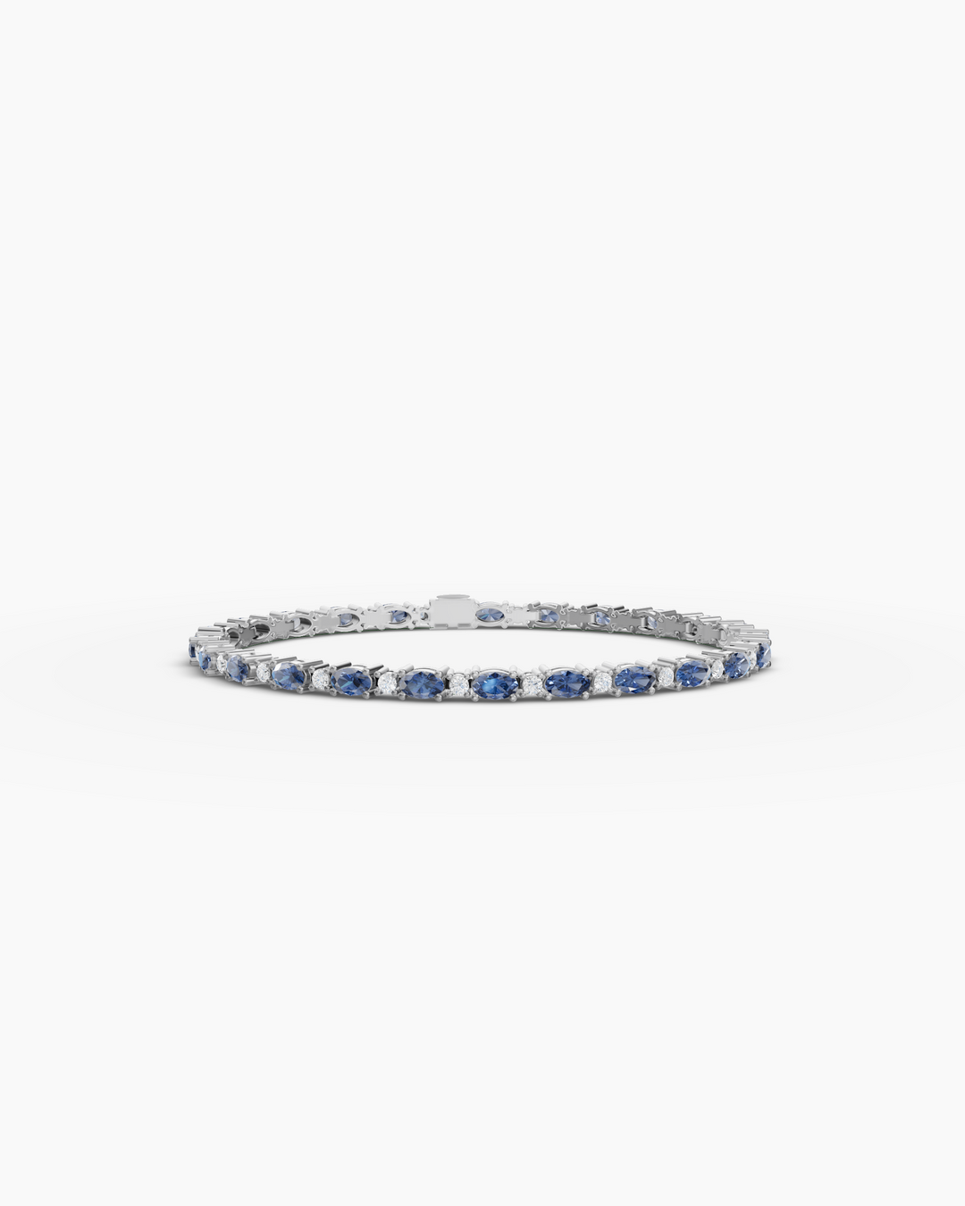 Silver bracelet with blue stones on a white background