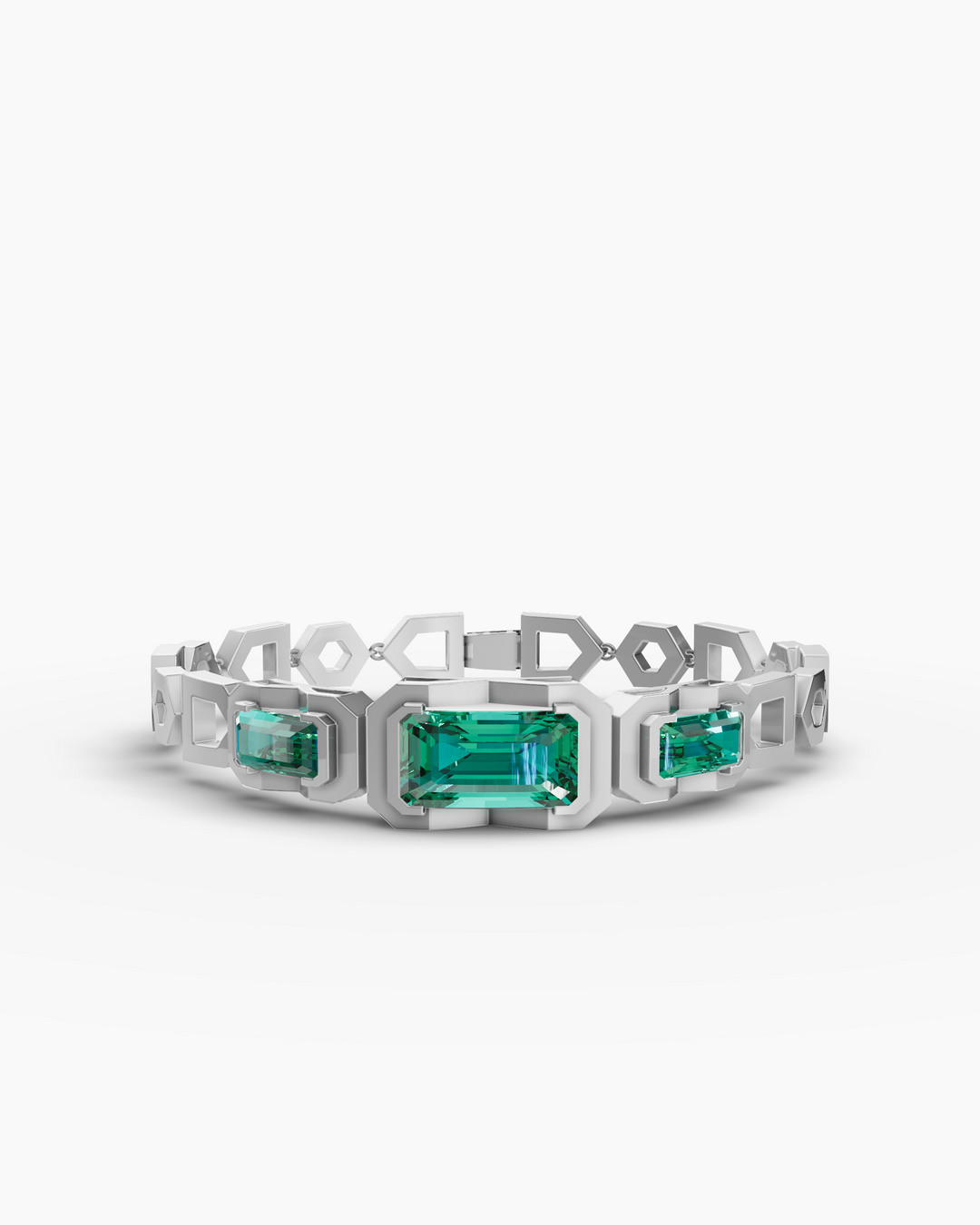 Silver bracelet with green gemstones on a white background