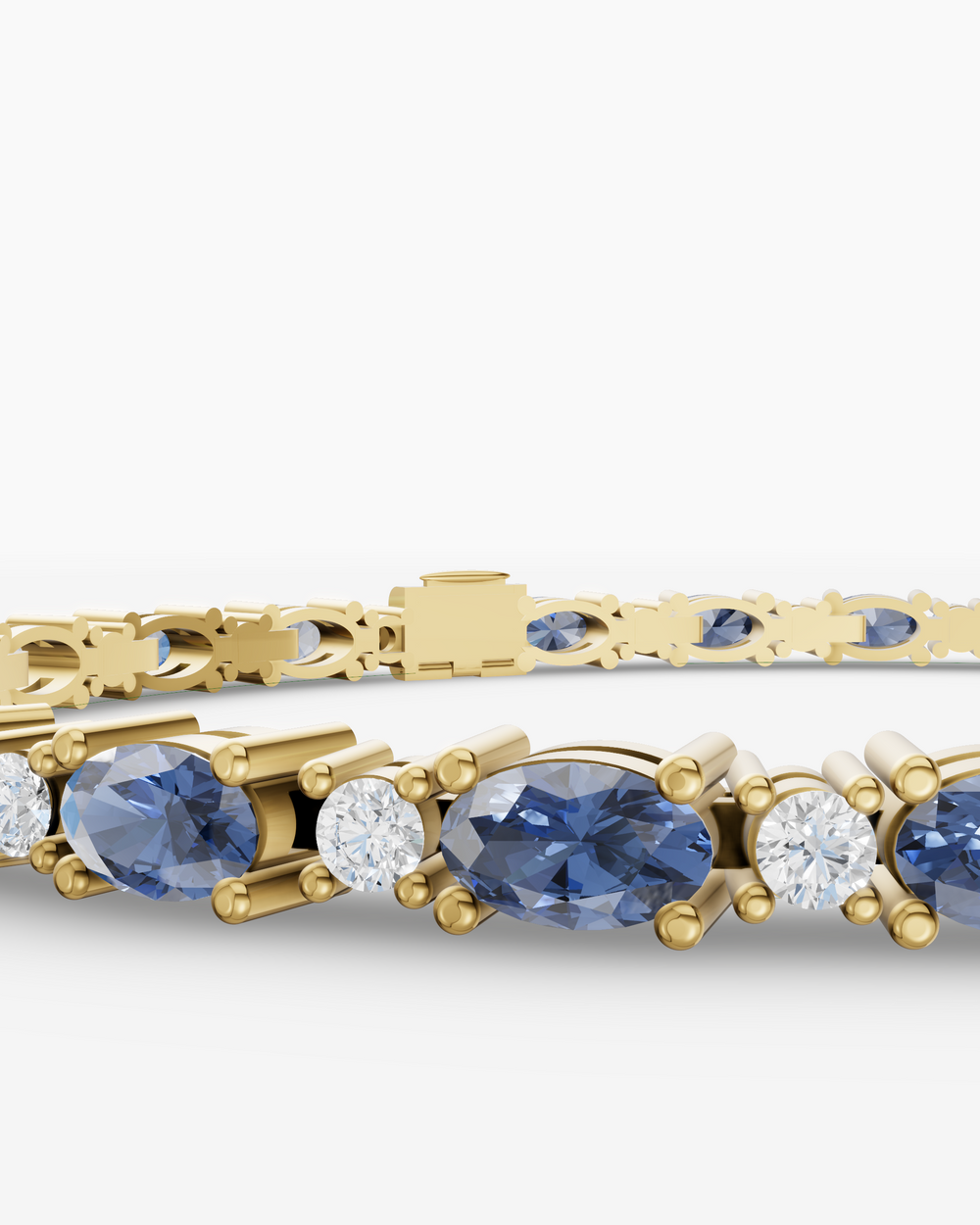 Gold bracelet with blue gemstones on a white background