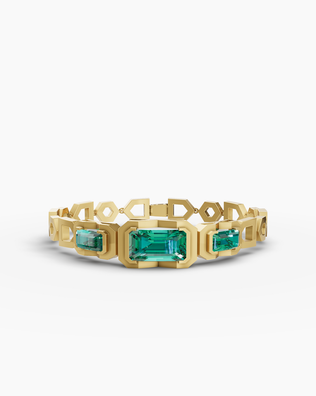 Gold bracelet with emerald green gemstones on a white background
