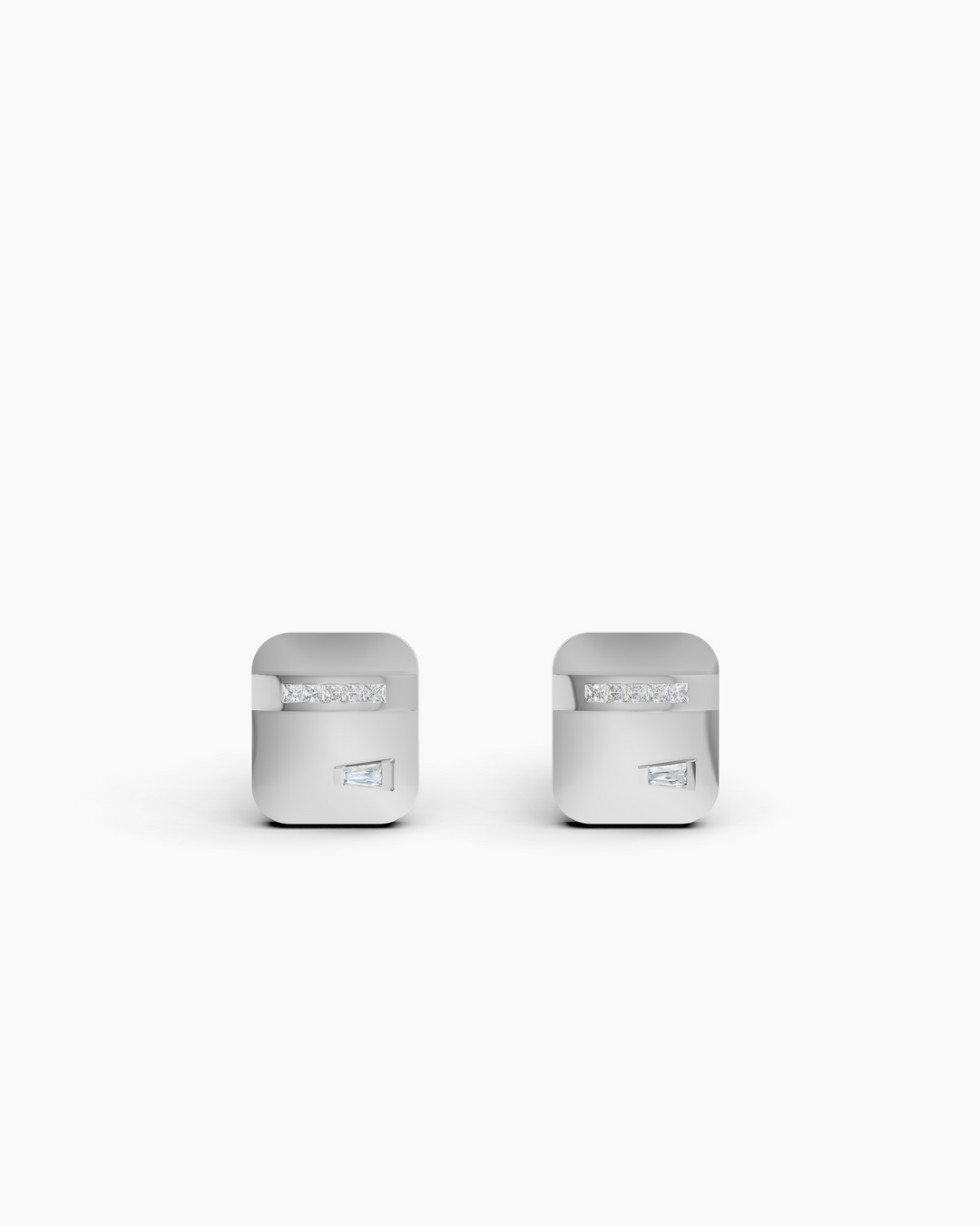 Pair of silver cufflinks on a white background