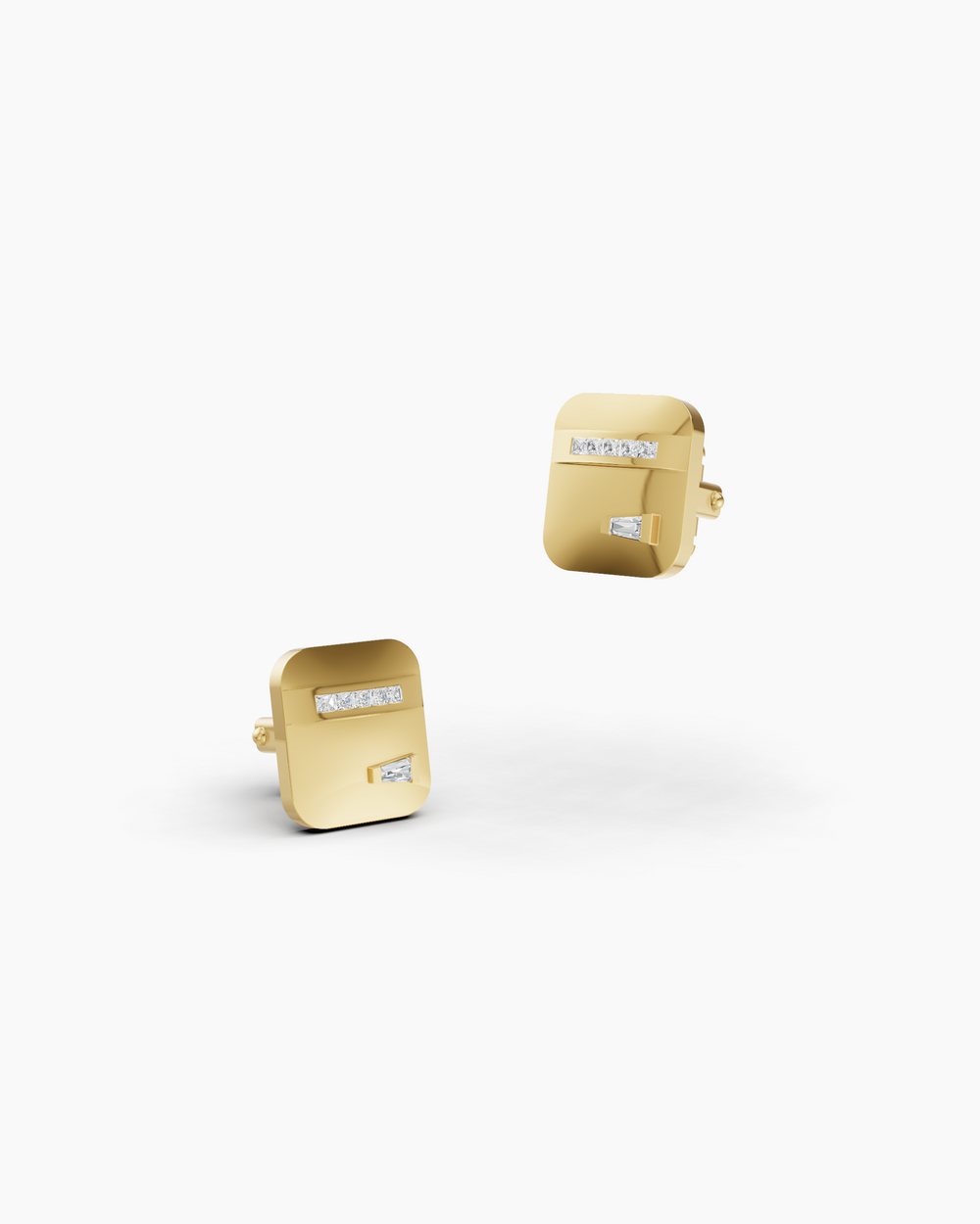 Gold cufflinks with embedded stones on a white background