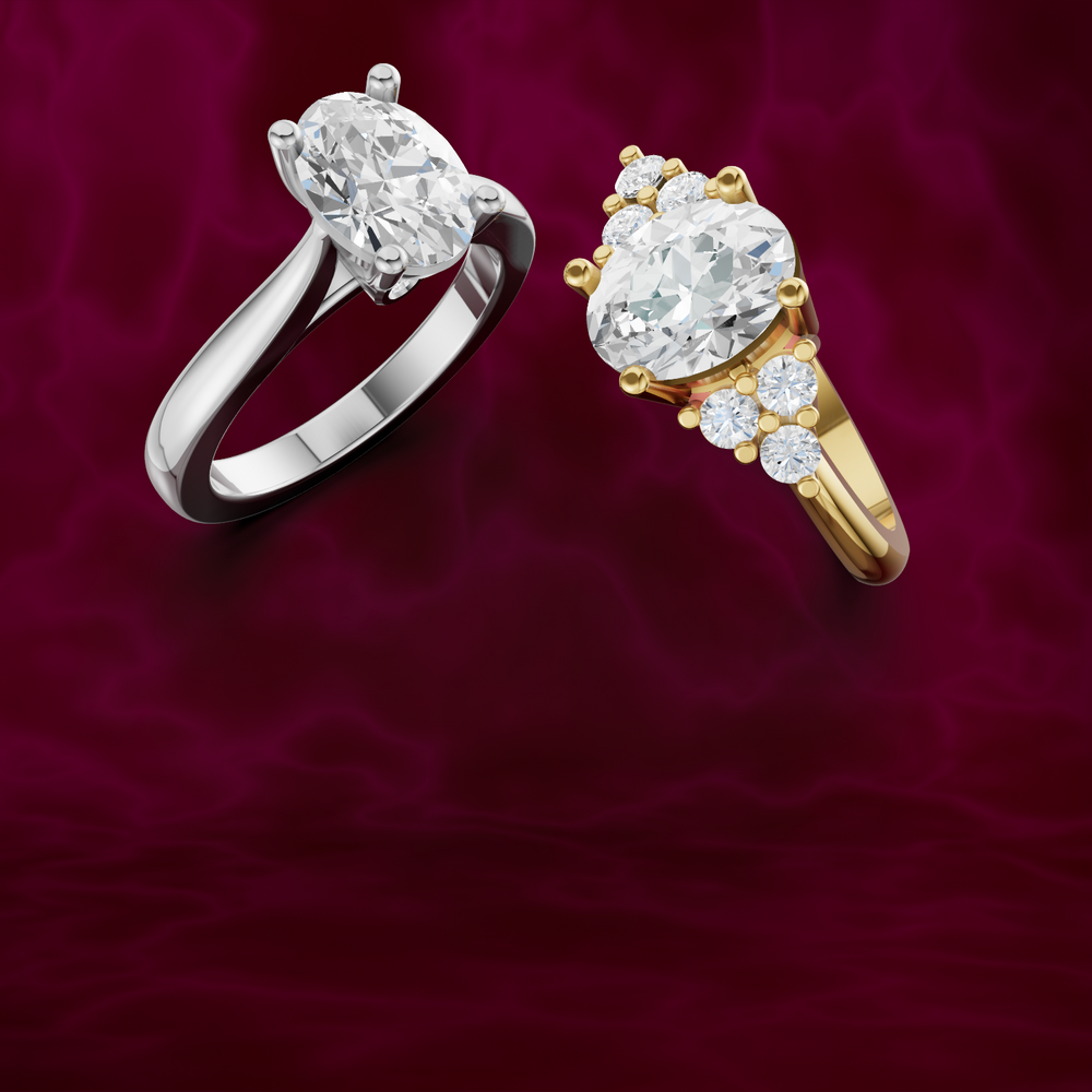 Two diamond rings, one white gold and one gold, on a red background