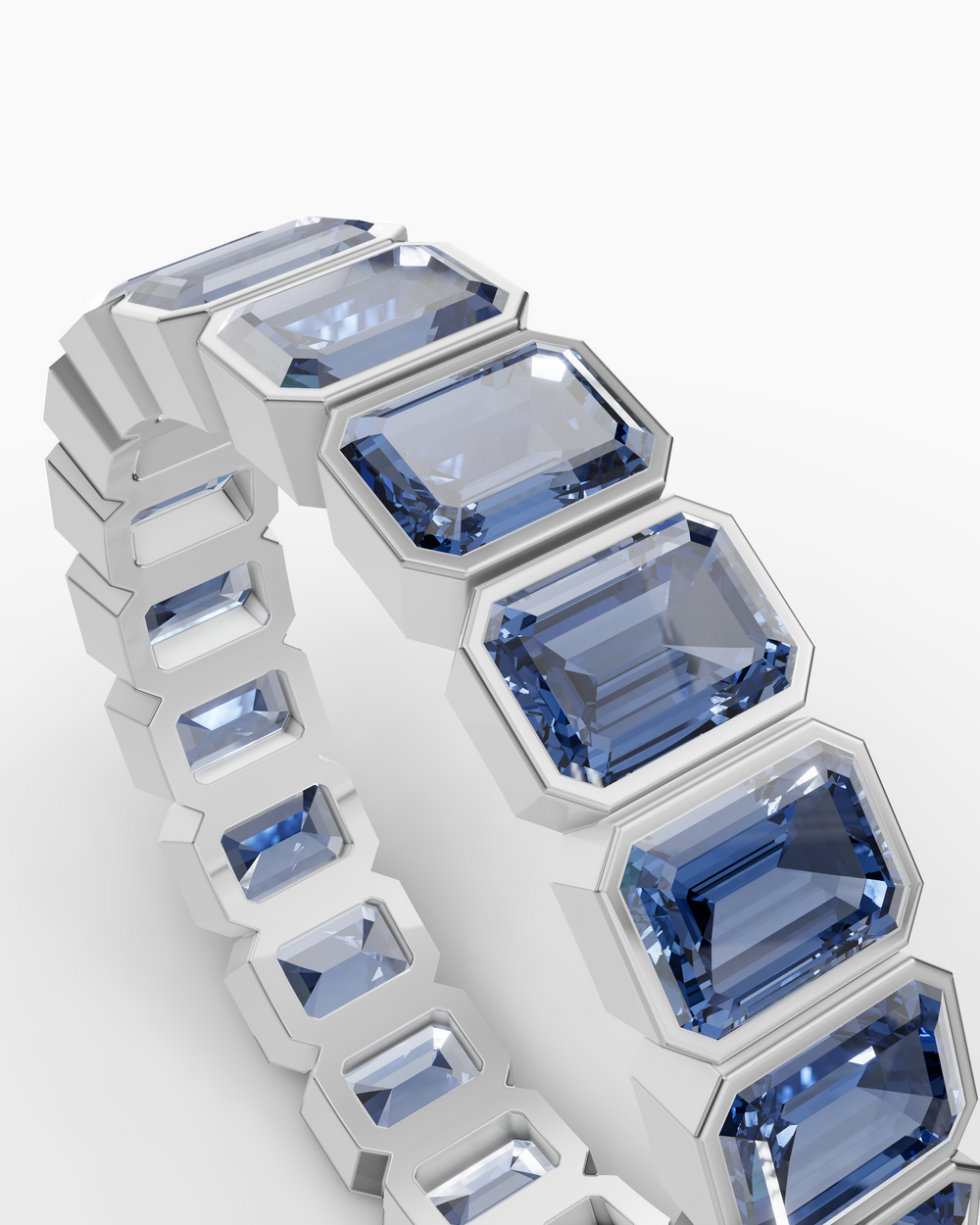 Ring with blue gemstones on a white background