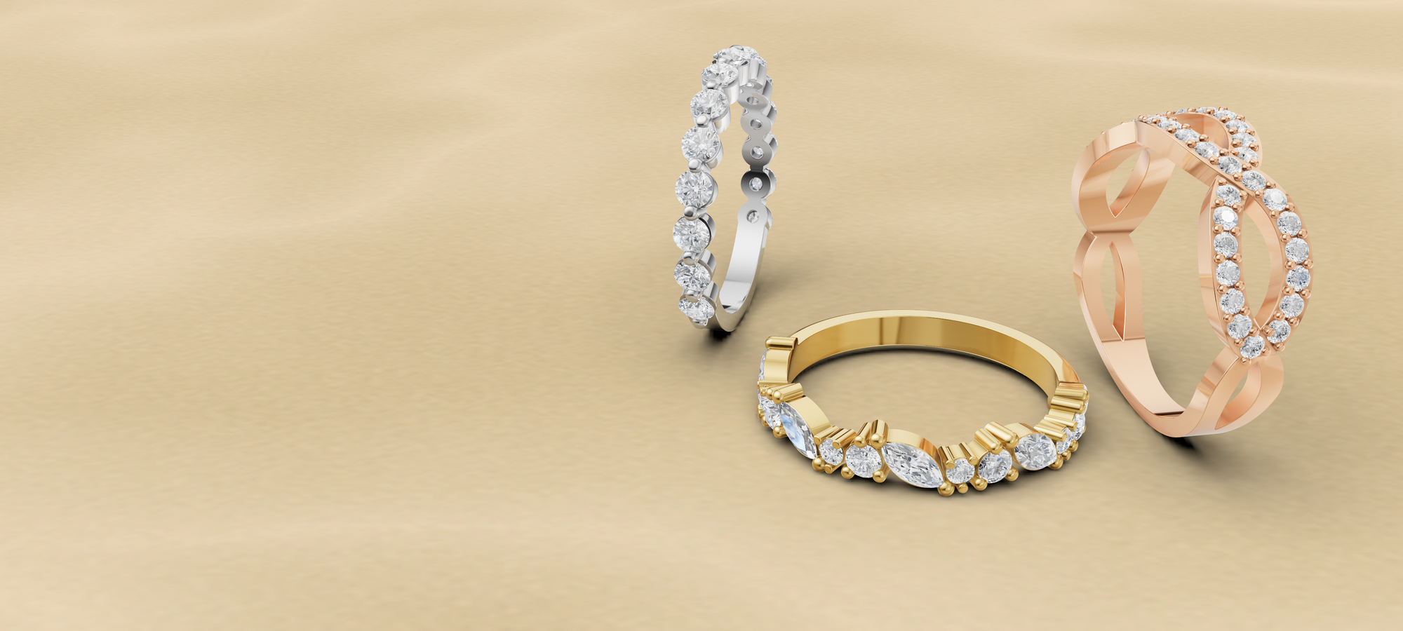 gold, white gold and rose gold ring on a beige background
