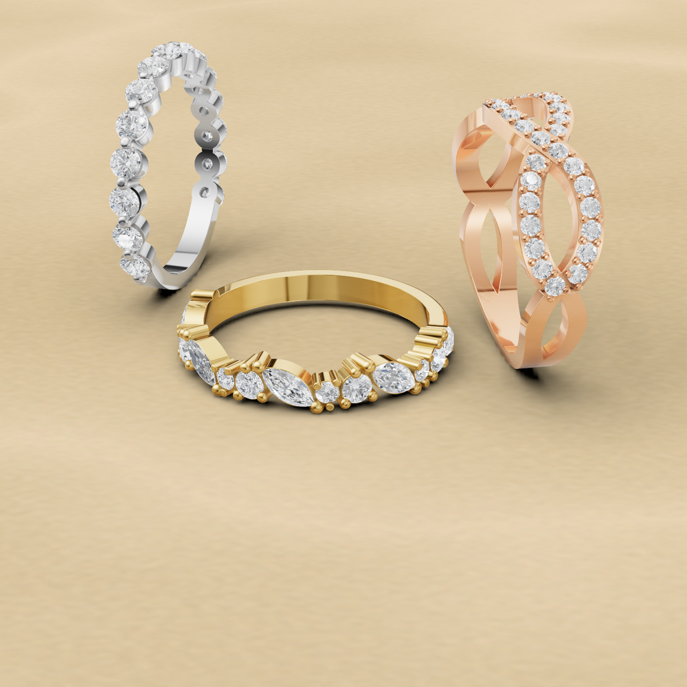gold, white gold, and rose gold ring on a beige background